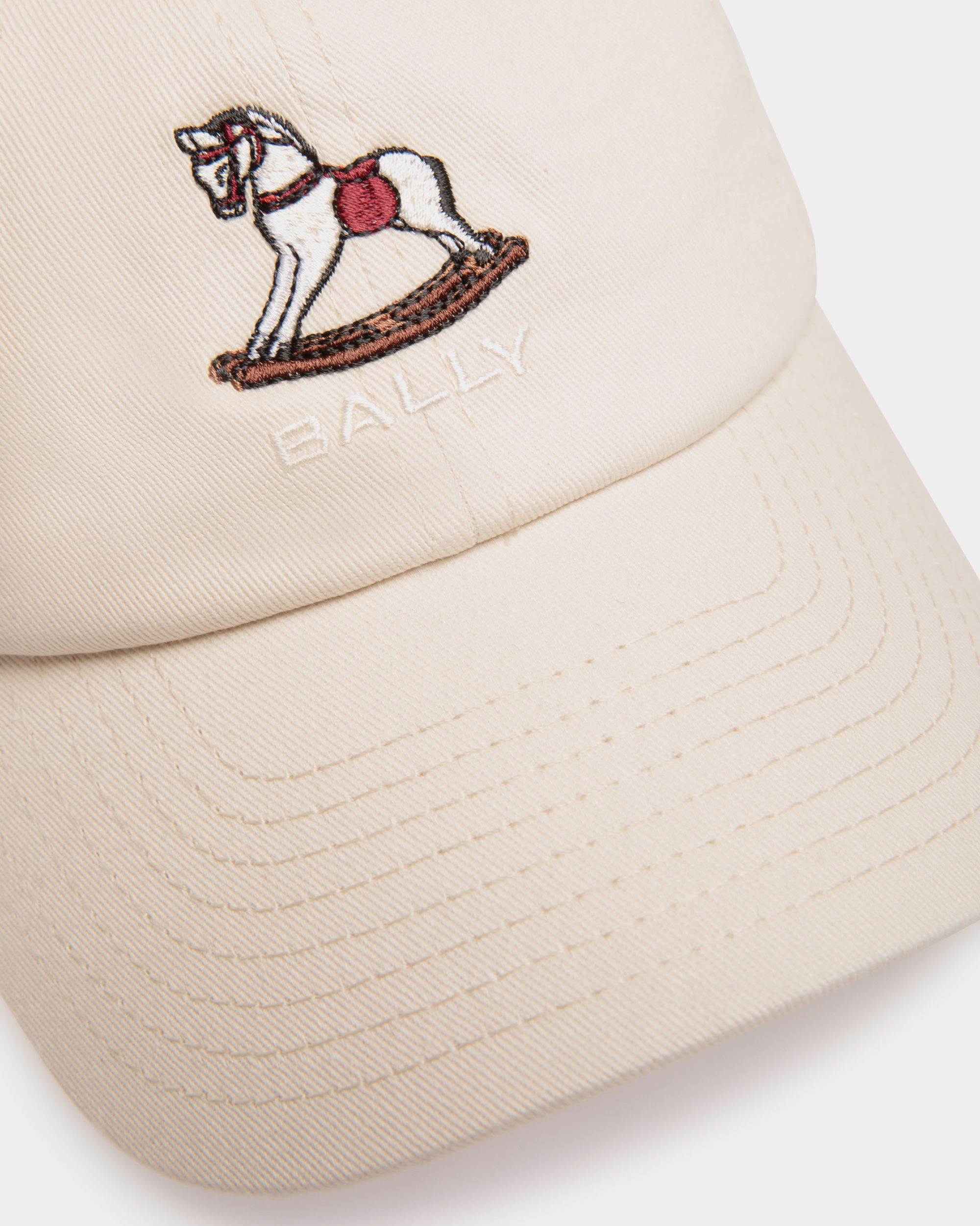 Bally Global - Baseball Hat with a Beni Bischof Rocking Horse in Ivory Cotton - White